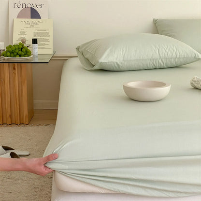 Solid washed cotton fitted sheet set in a minimalist bedroom – RoomDen