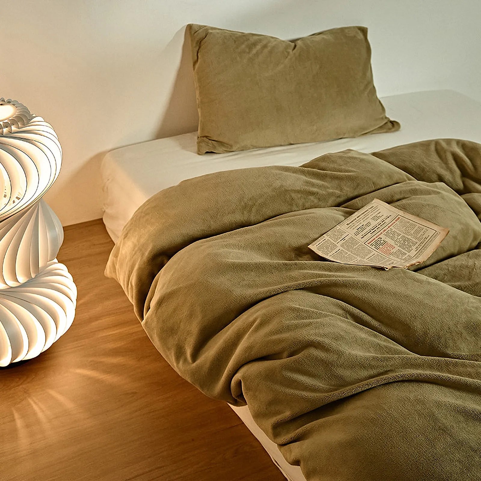 Solid olive-khaki fleece duvet cover on a minimalist bed – RoomDen