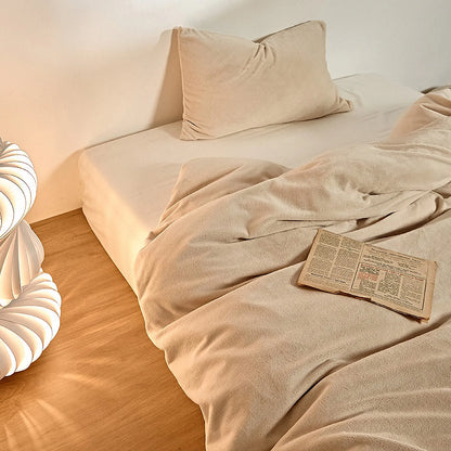 Solid cream-beige fleece duvet cover in warm minimalist room – RoomDen