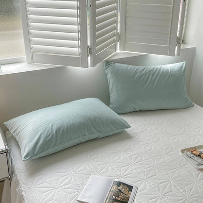 Soft flannel fleece pillowcase in a cozy minimalist bedroom setting – RoomDen