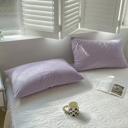 Soft flannel fleece pillowcase in a cozy minimalist bedroom setting – RoomDen