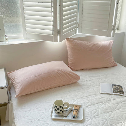 Soft flannel fleece pillowcase in a cozy minimalist bedroom setting – RoomDen