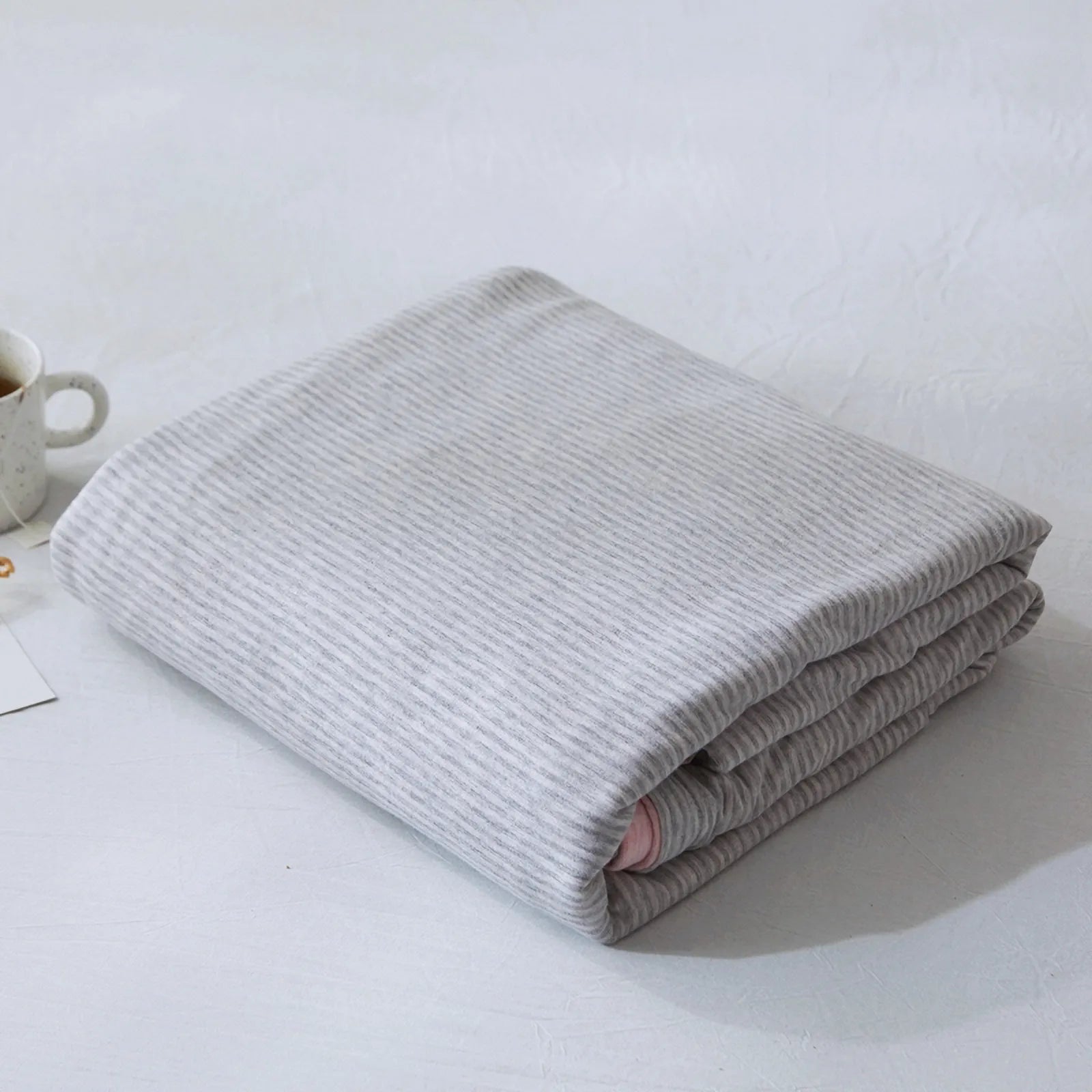 Striped washed cotton duvet cover set folded view – RoomDen