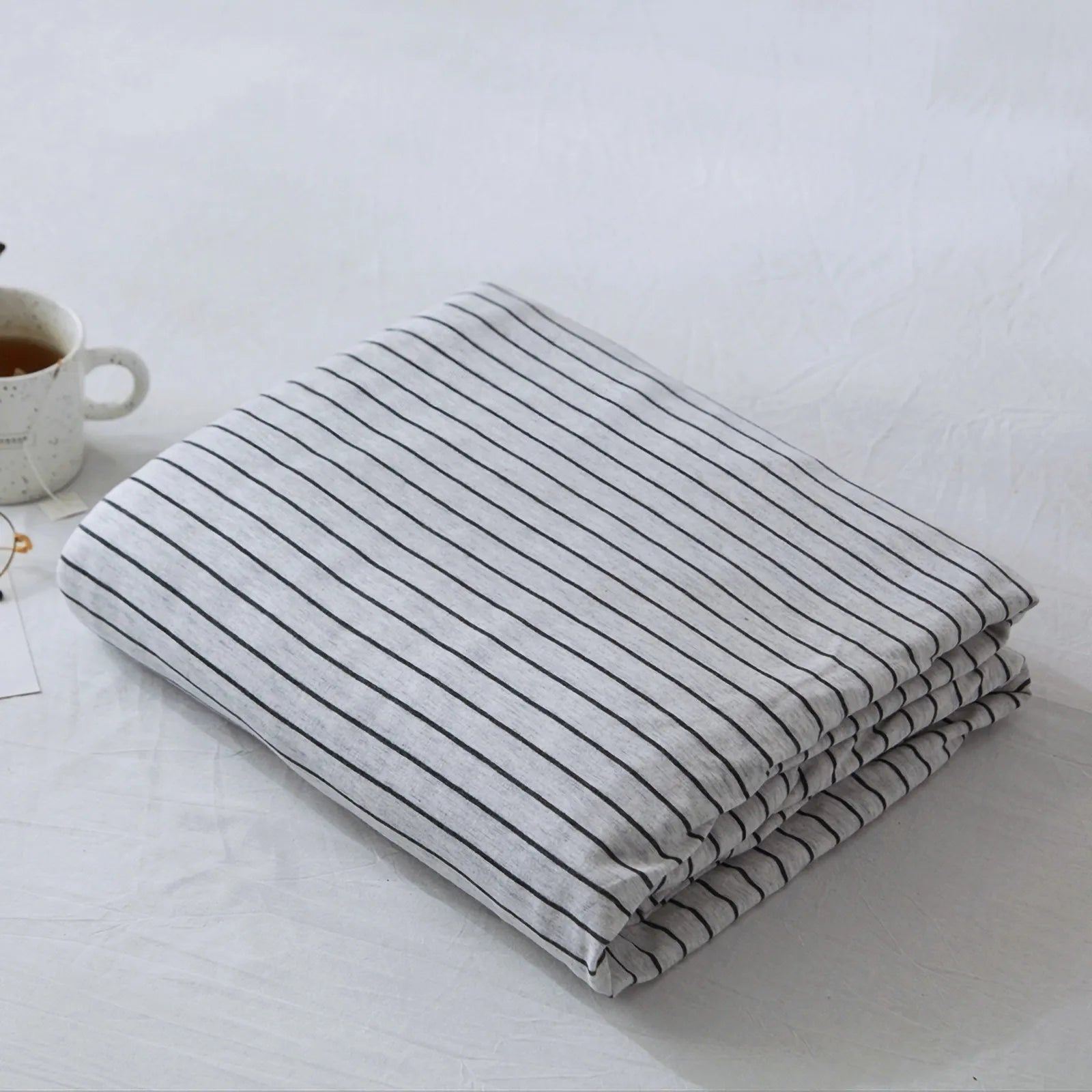 Striped washed cotton duvet cover set folded view – RoomDen