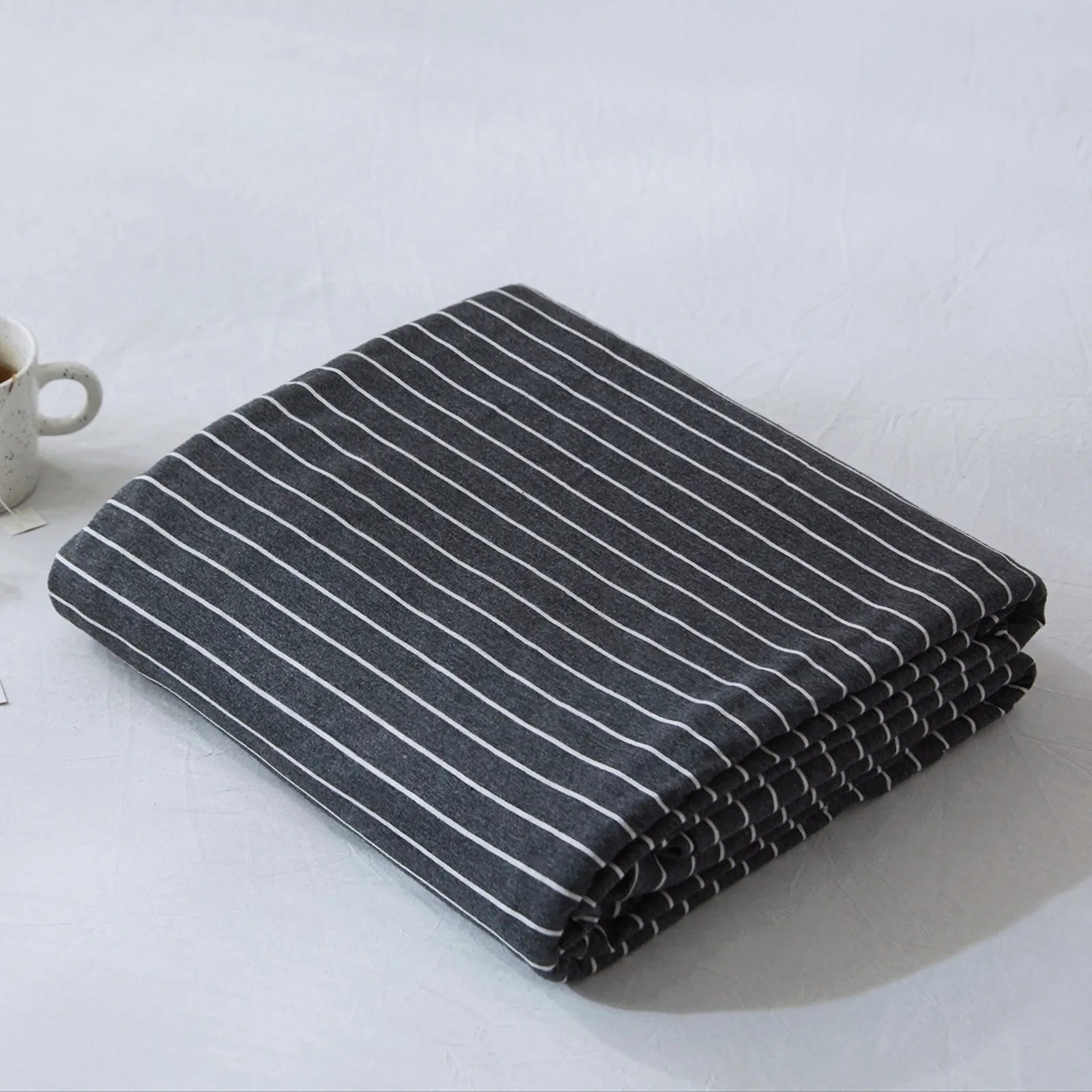 Striped washed cotton duvet cover set folded view – RoomDen