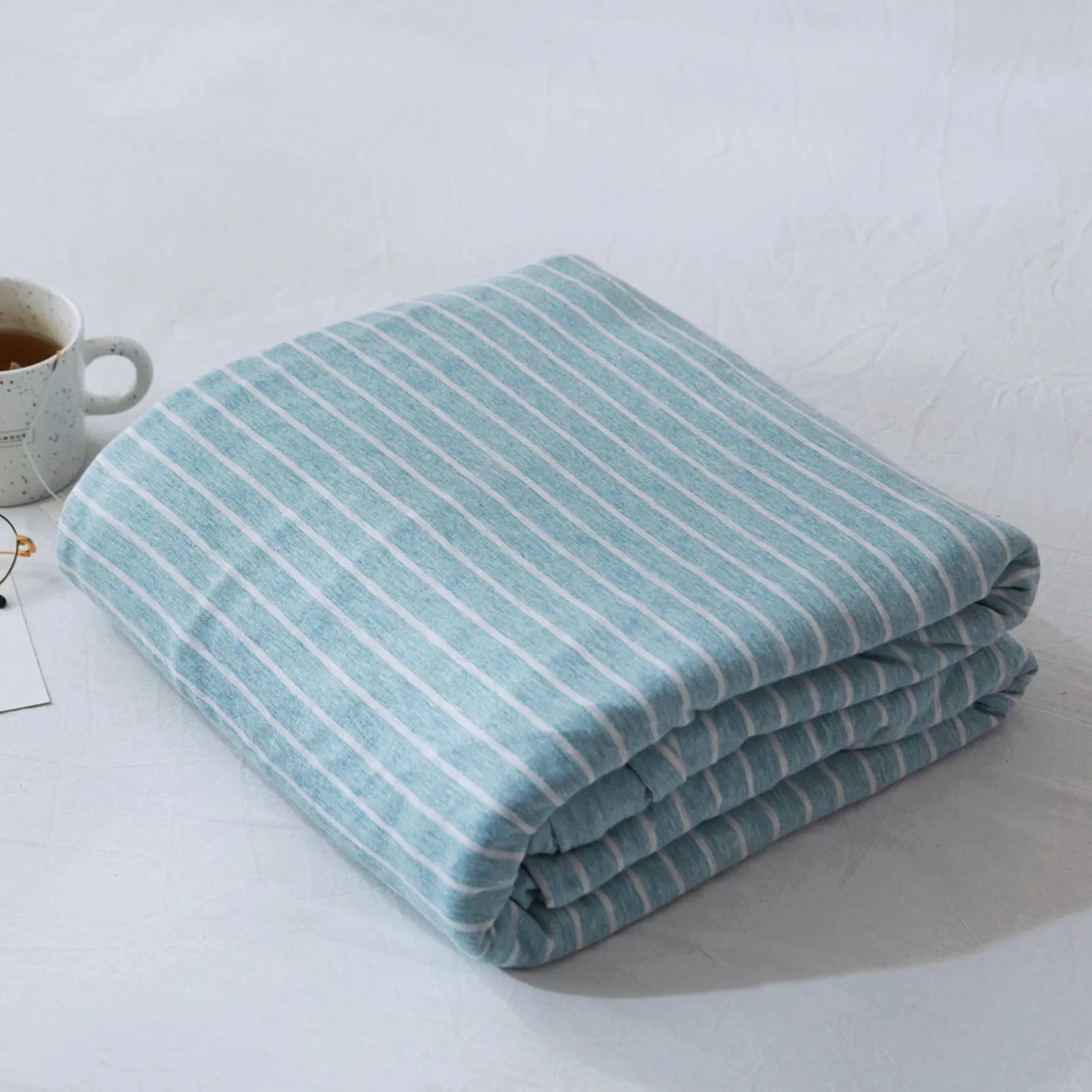 Striped washed cotton duvet cover set folded view – RoomDen