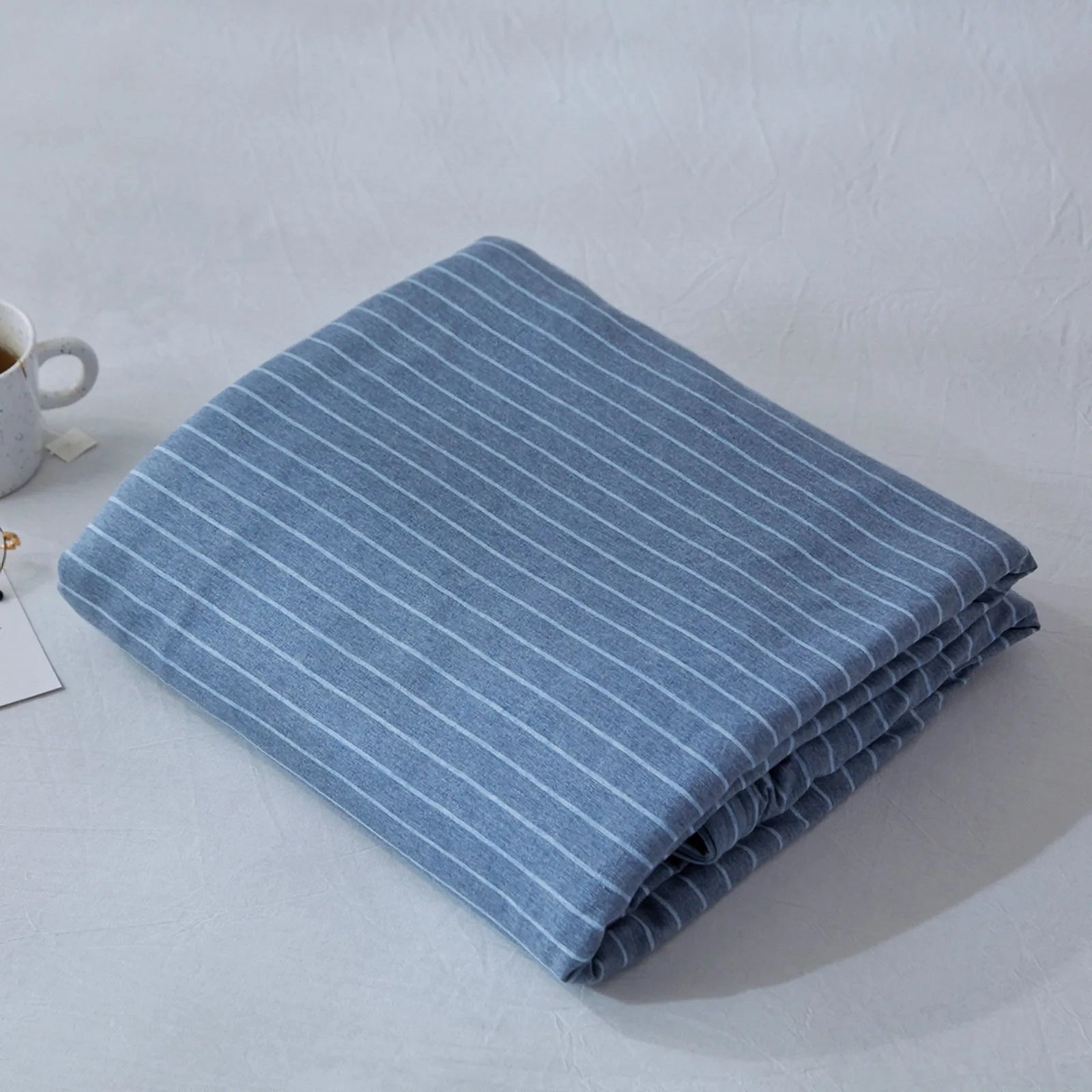 Striped washed cotton duvet cover set folded view – RoomDen