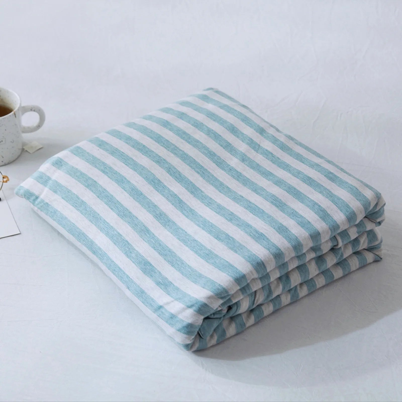 Striped washed cotton duvet cover set folded view – RoomDen