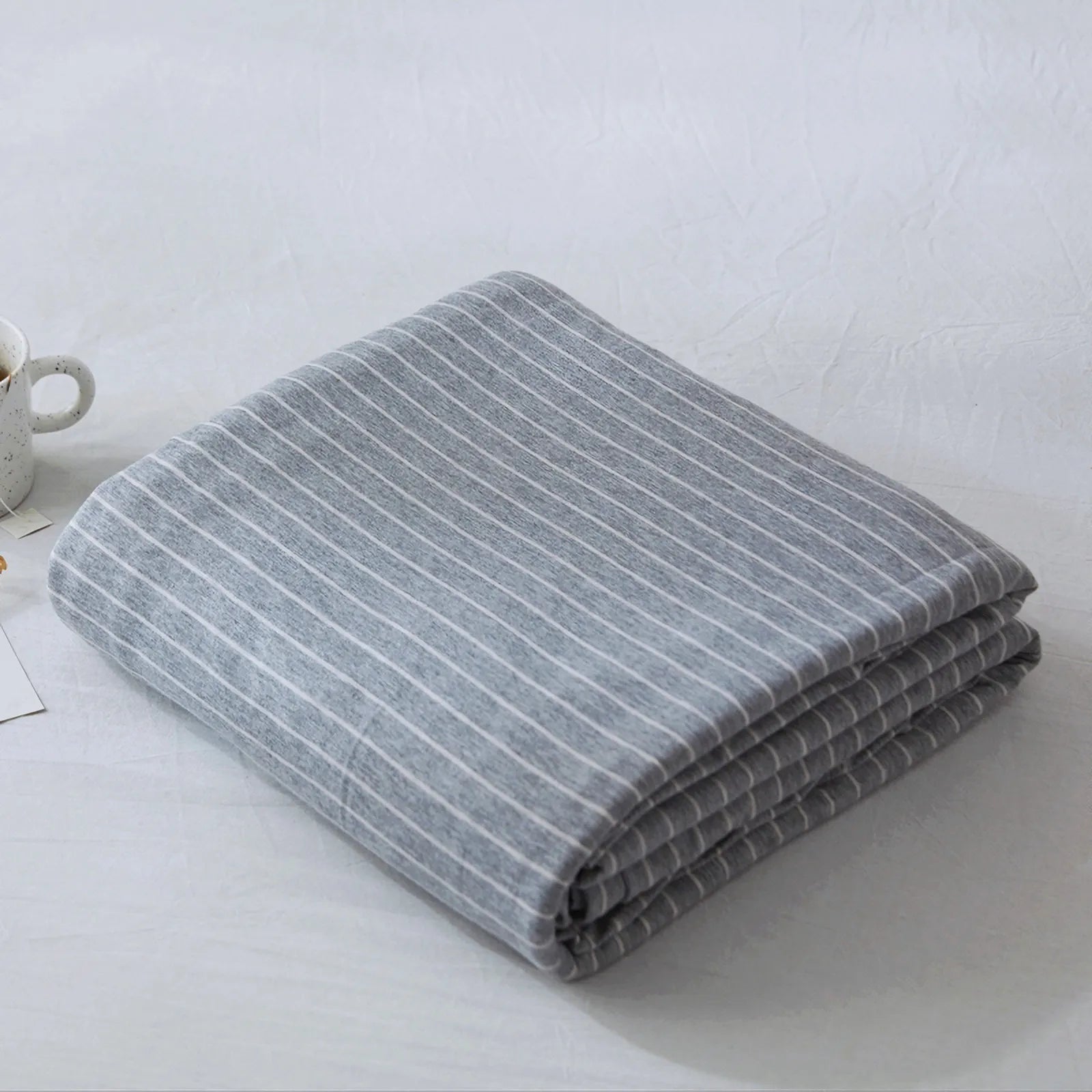 Striped washed cotton duvet cover set folded view – RoomDen