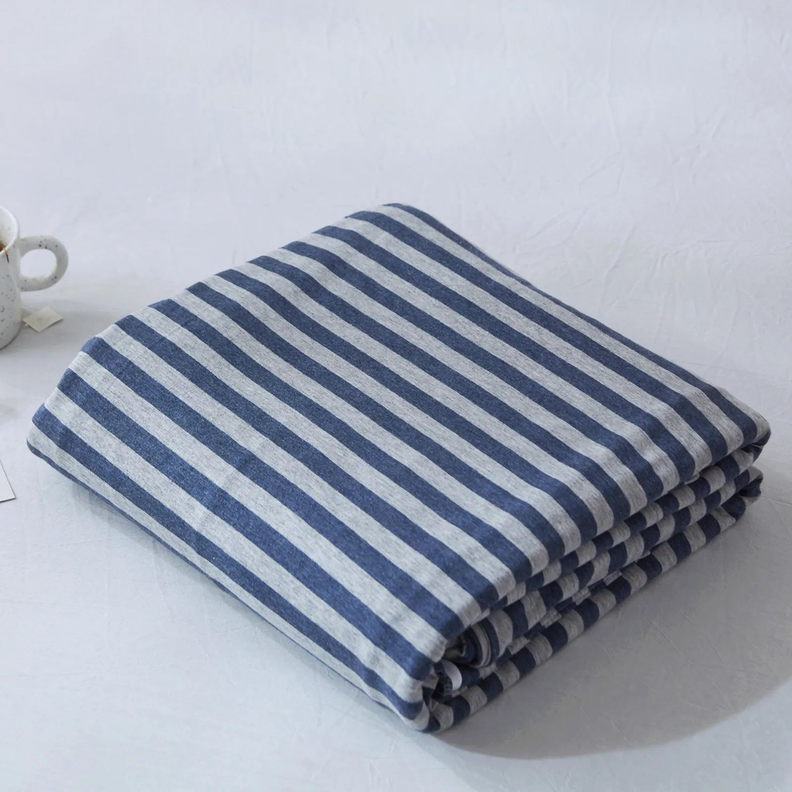 Striped washed cotton duvet cover set folded view – RoomDen