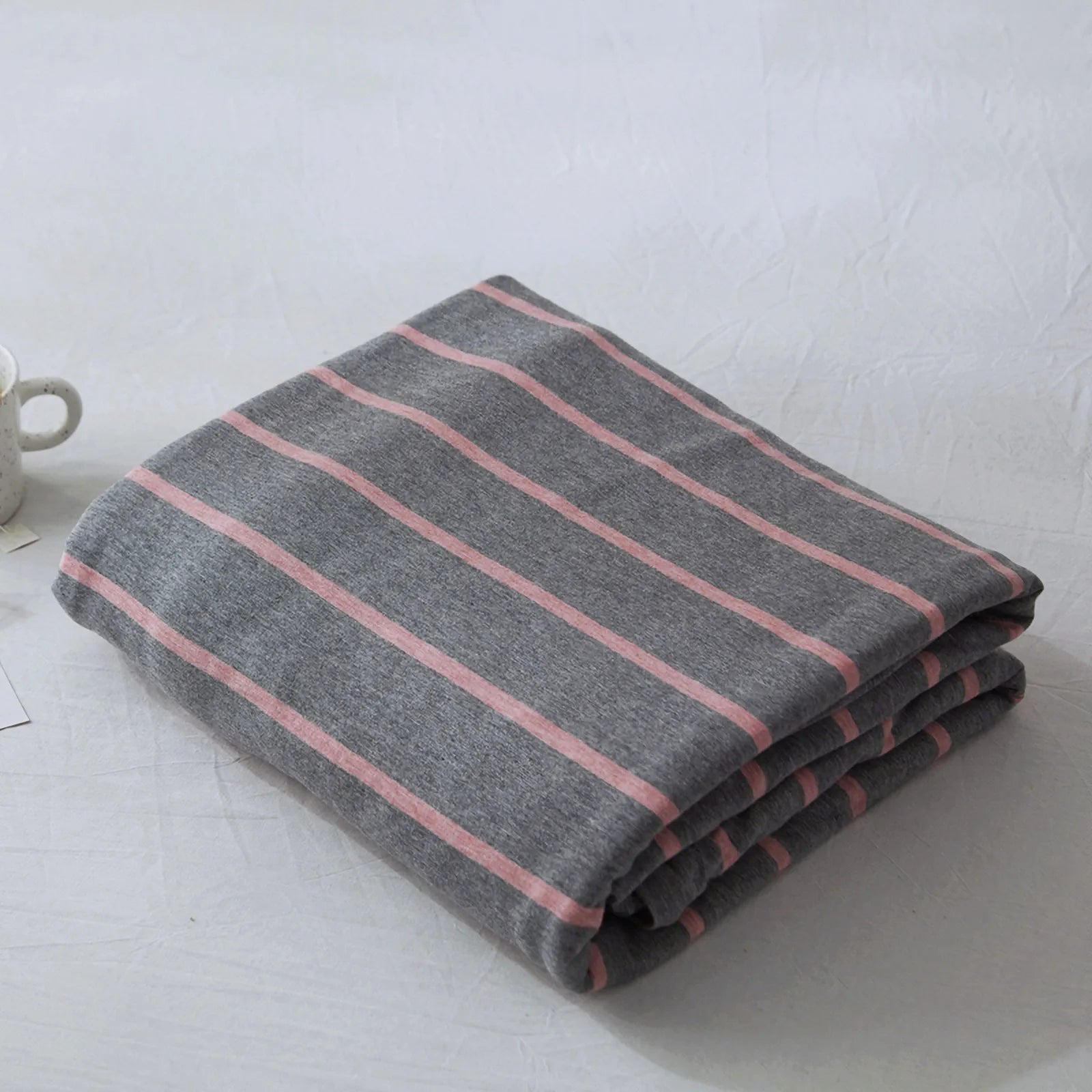 Striped washed cotton duvet cover set folded view – RoomDen