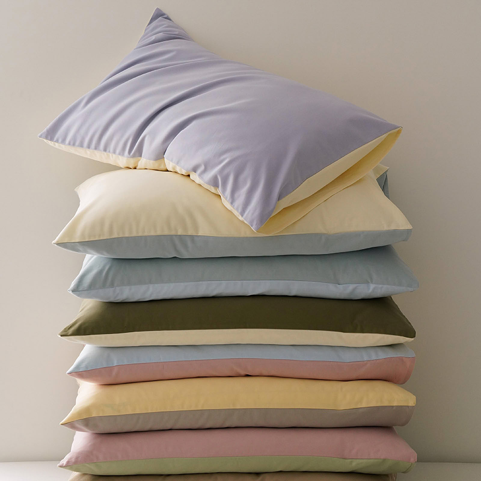 Minimalist two-tone washed cotton pillowcase in soft solid colors – RoomDen