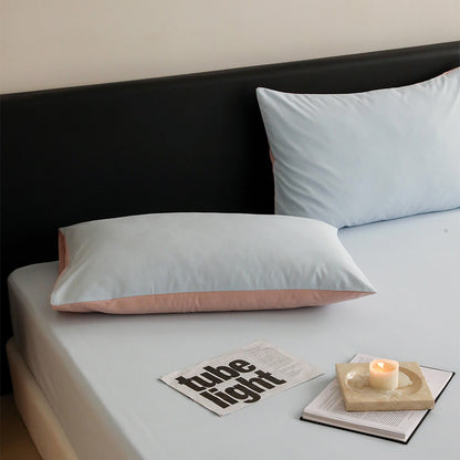 Minimalist two-tone washed cotton pillowcase in soft solid colors – RoomDen