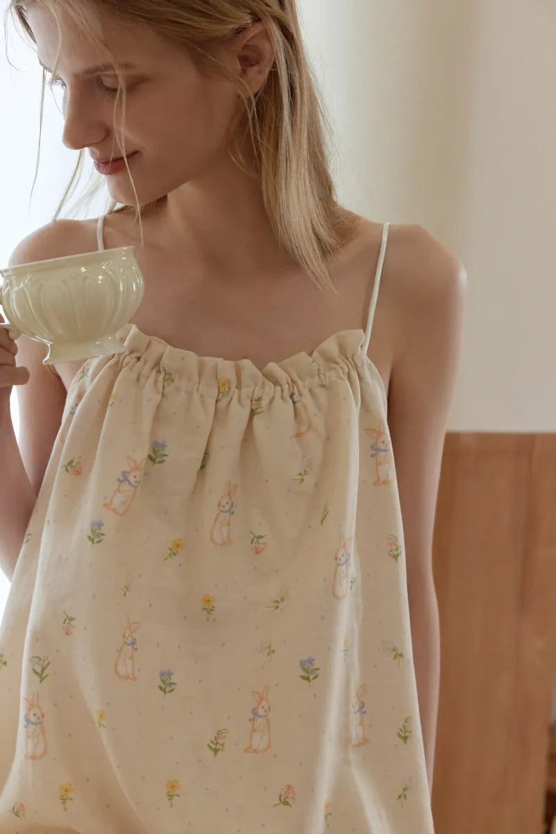 Beige cotton pajama set with pastel rabbit and floral print in a soft cozy home style – RoomDen
