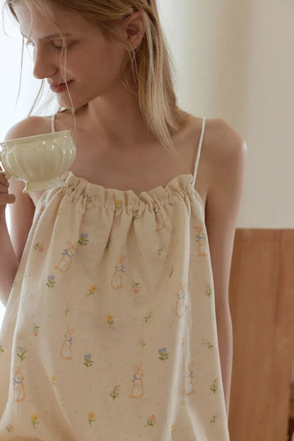 Beige cotton pajama set with pastel rabbit and floral print in a soft cozy home style – RoomDen