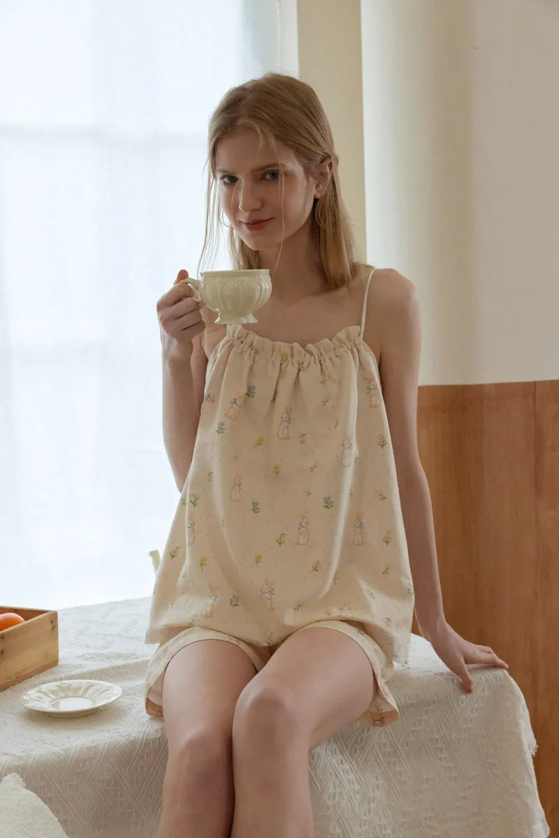 Beige cotton pajama set with pastel rabbit and floral print in a soft cozy home style – RoomDen