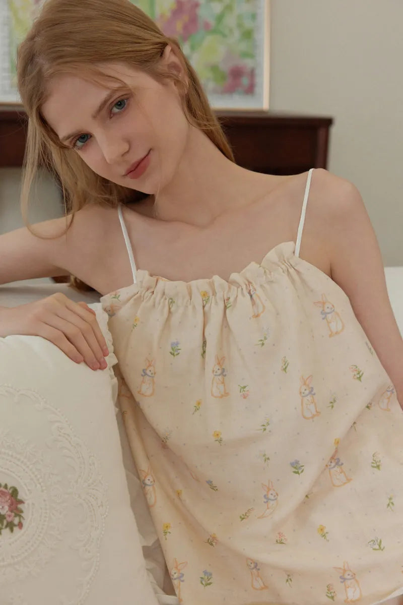 Beige cotton pajama set with pastel rabbit and floral print in a soft cozy home style – RoomDen