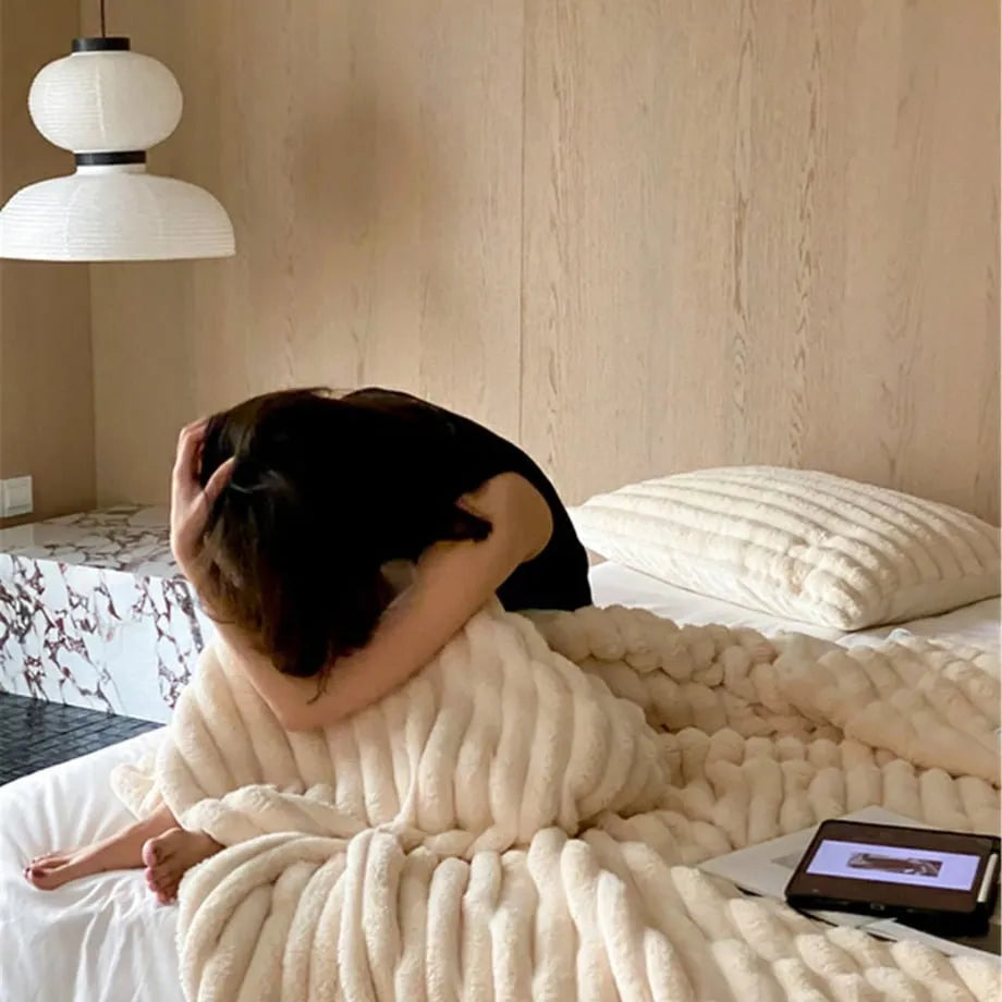 Ripple textured plush faux fur throw blanket in a cozy bedroom setting – RoomDen