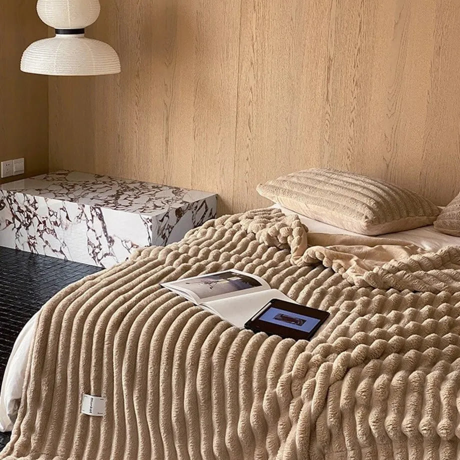 Ripple textured plush faux fur throw blanket in a cozy bedroom setting – RoomDen