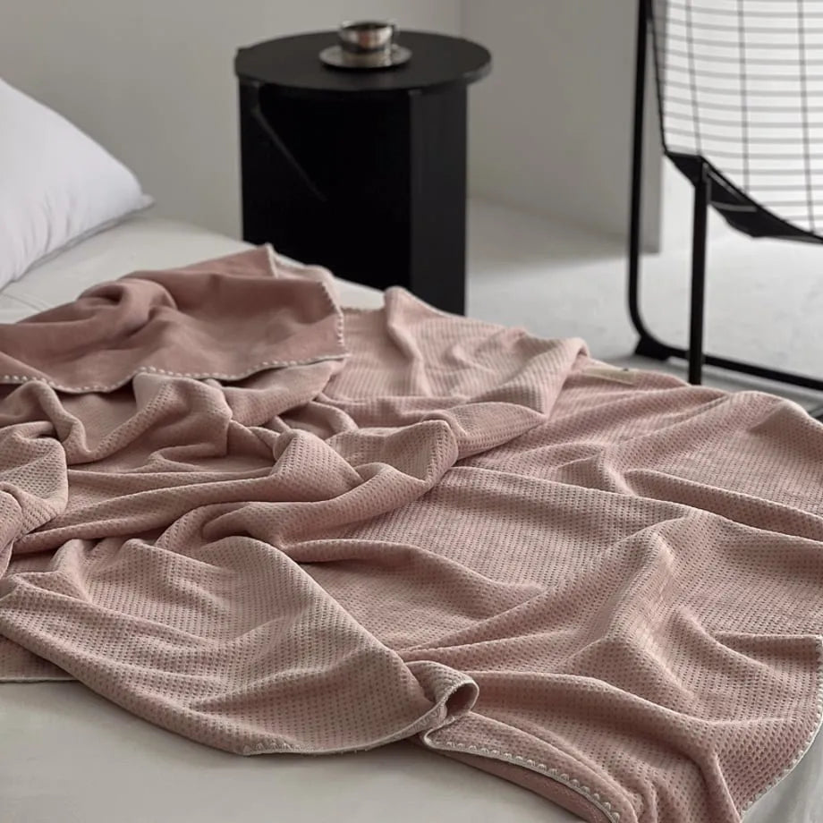 Soft waffle texture flannel fleece throw blanket in a minimalist cozy bedroom setting – RoomDen