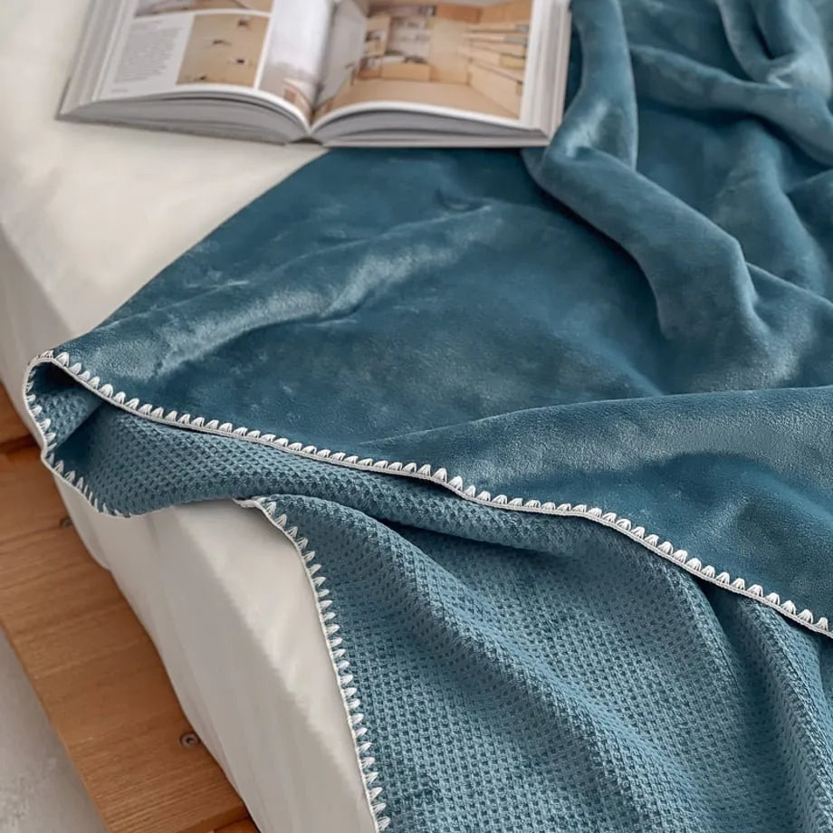 Soft waffle texture flannel fleece throw blanket in a minimalist cozy bedroom setting – RoomDen