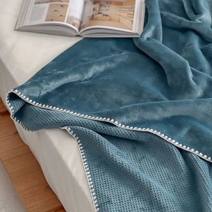 Soft waffle texture flannel fleece throw blanket in a minimalist cozy bedroom setting – RoomDen