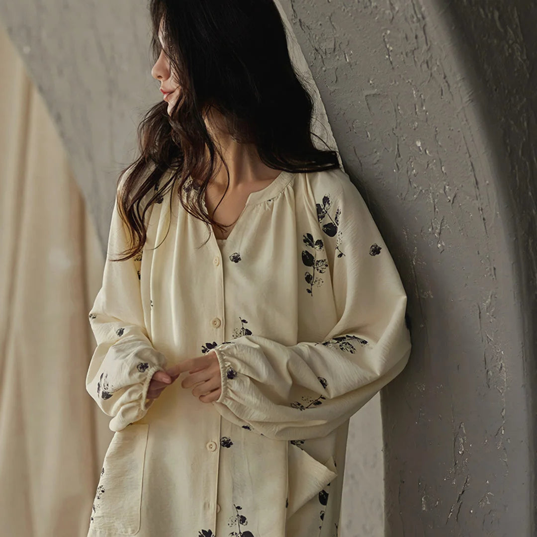 Close-up on the gathered elastic cuff of the botanical print pajama top's sleeve - RoomDen