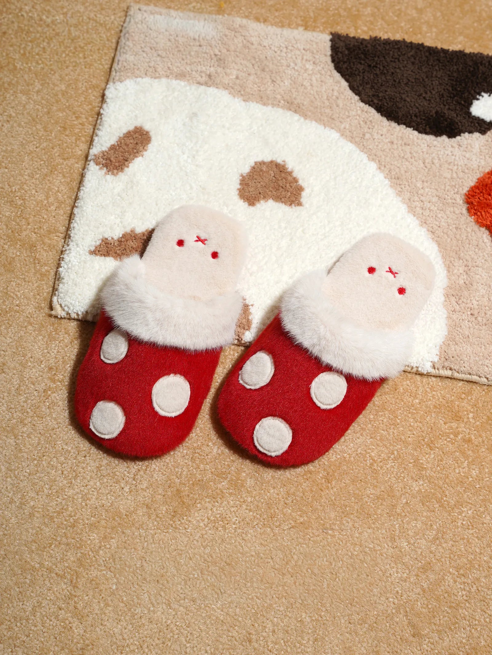 Red polka dot bunny slippers on rug - RoomDen