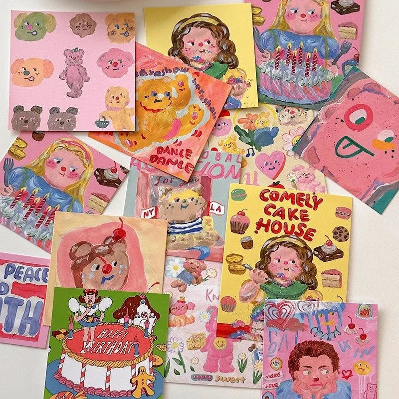 An overhead shot of the complete set of whimsical and colorful art prints from the wall collage kit spread out on a surface.