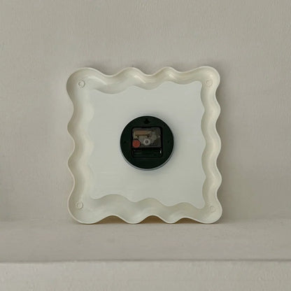Back view of the Wavy Squiggle Clock, showing the battery compartment and mounting mechanism. - RoomDen