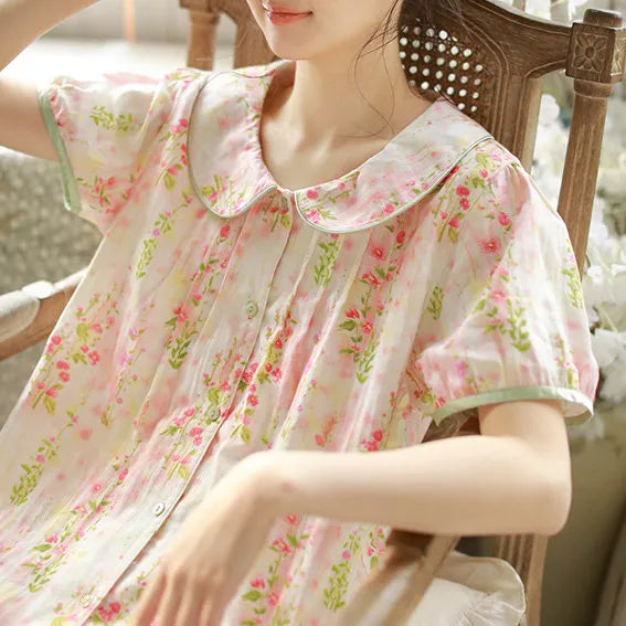 Close up detail of Peter Pan collar with green piping and ruched pleats on floral sleepwear - RoomDen