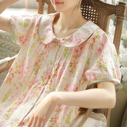 Close up detail of Peter Pan collar with green piping and ruched pleats on floral sleepwear - RoomDen