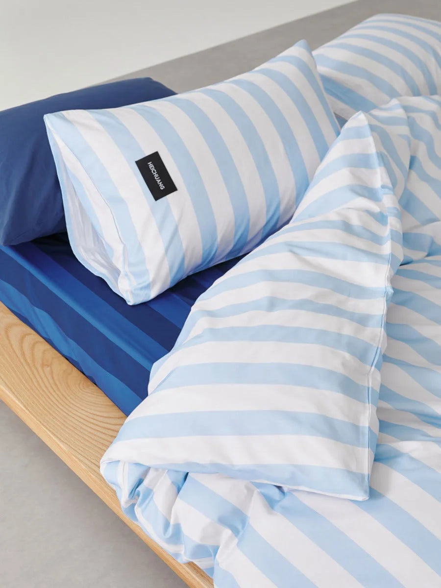 Close up of Sky Blue & White Striped fabric folds and texture - RoomDen