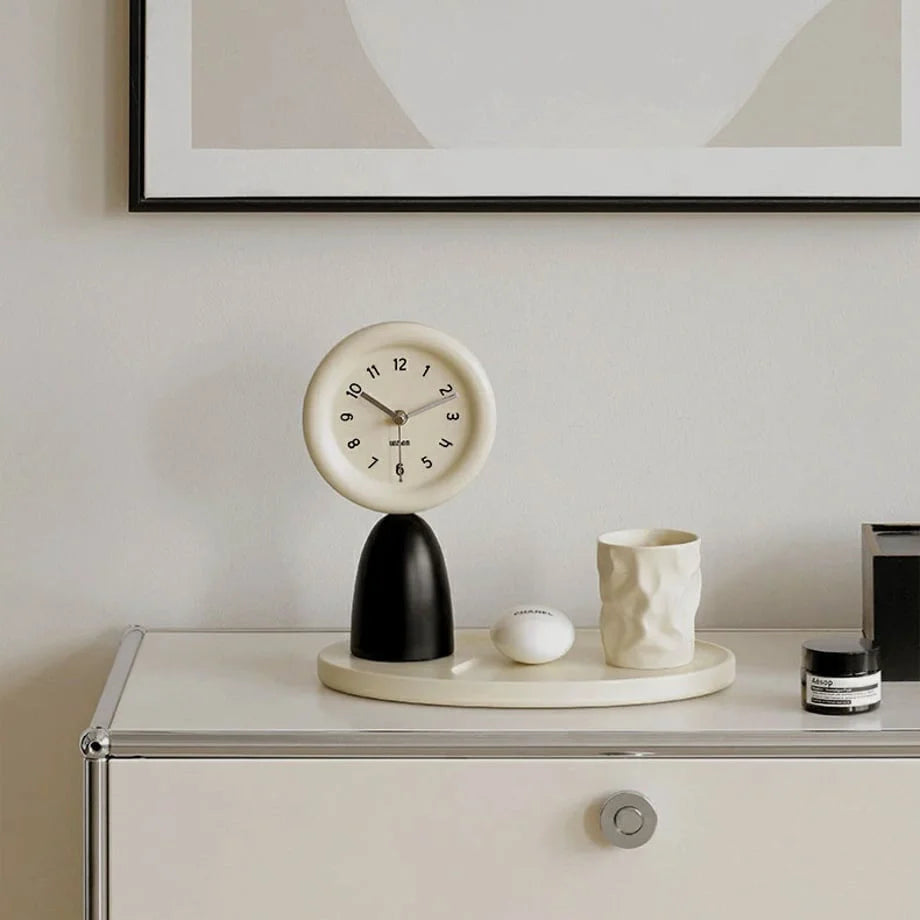Minimalist black and beige table clock with tray on a white modern credenza. - RoomDen