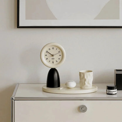 Minimalist black and beige table clock with tray on a white modern credenza. - RoomDen