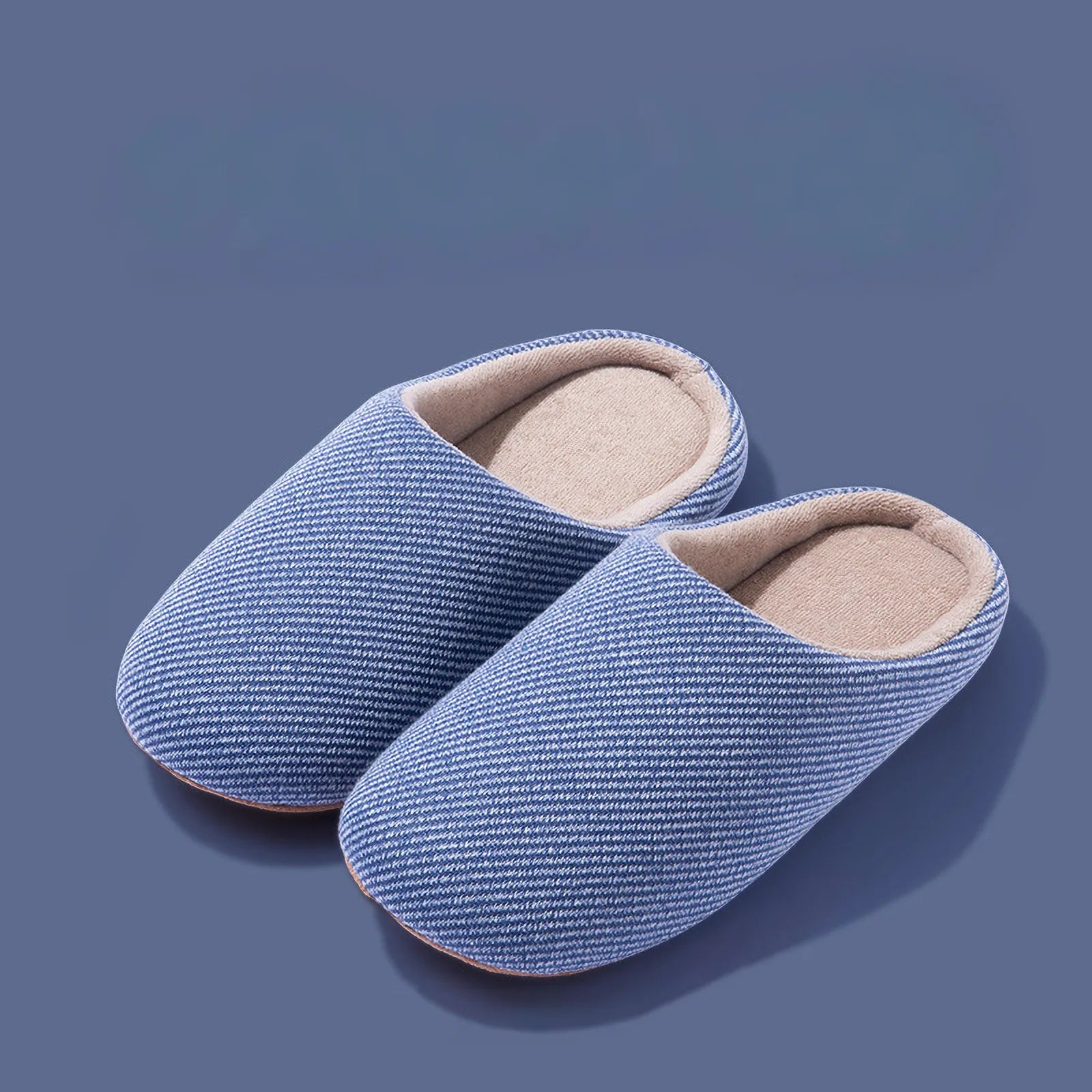 Pair of blue ribbed cotton house slippers isolated roomden