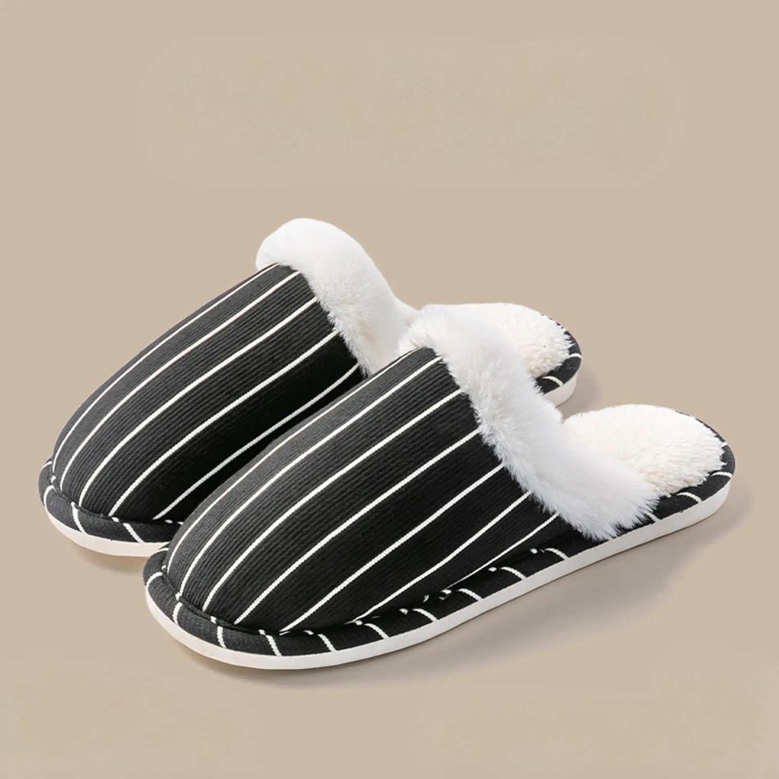 Pair of Black and White striped corduroy slippers on beige background - RoomDen