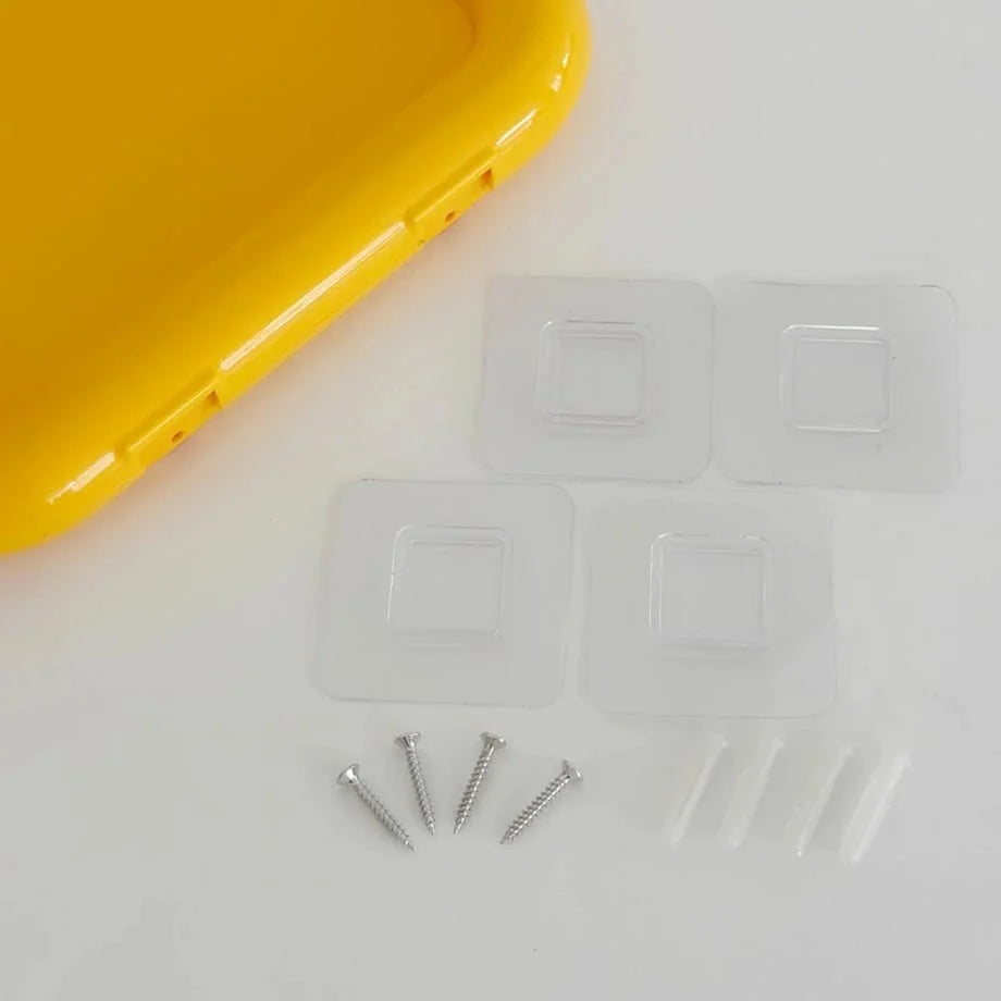 The included installation hardware: adhesive pads for drill-free mounting and screws with anchors for drilling. - RoomDen