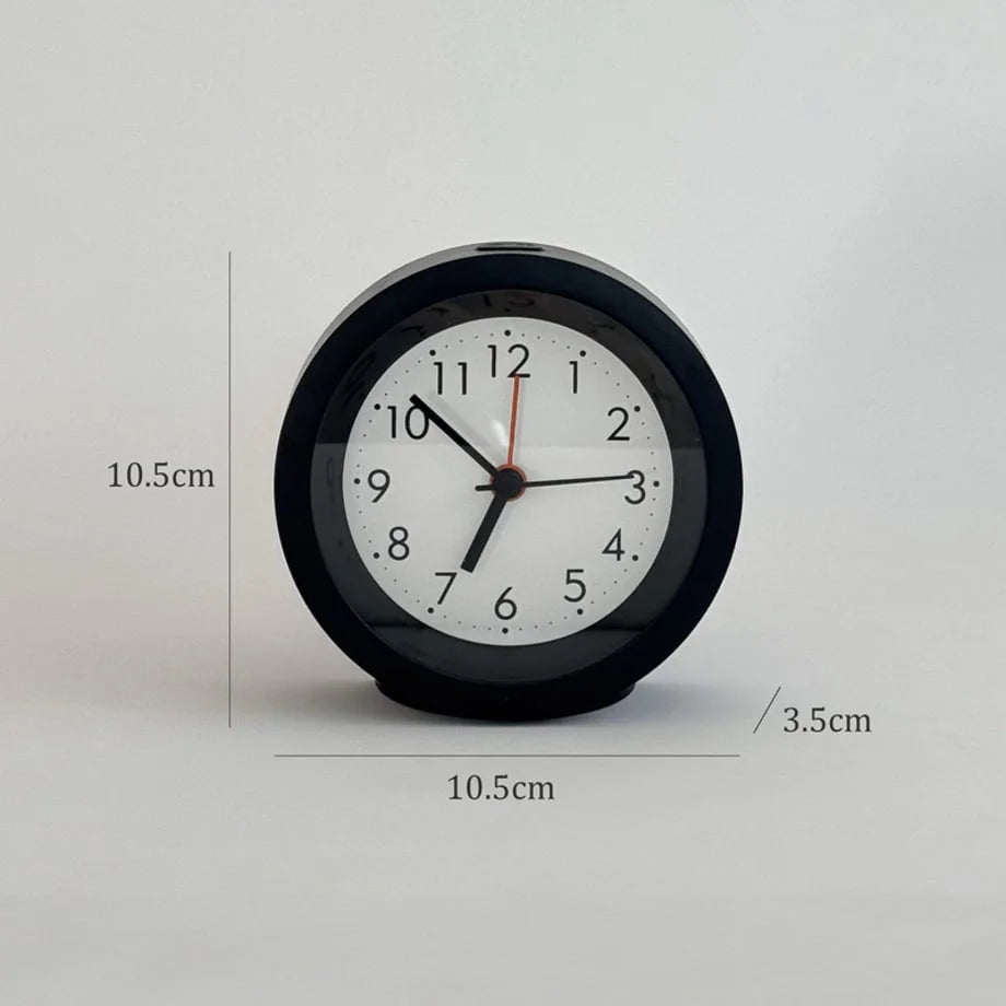 The black analog alarm clock with dimensions displayed: 10.5cm by 10.5cm by 3.5cm. - RoomDen