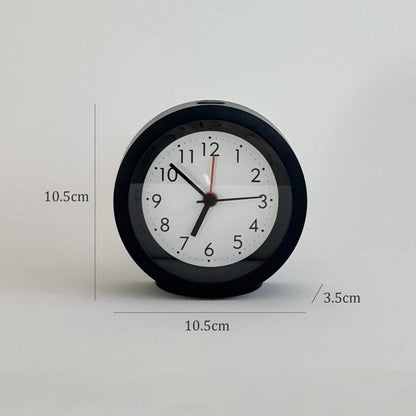 The black analog alarm clock with dimensions displayed: 10.5cm by 10.5cm by 3.5cm. - RoomDen
