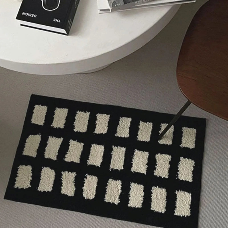 Close up detail showing the high-pile texture of the cream blocks against a black base - RoomDen