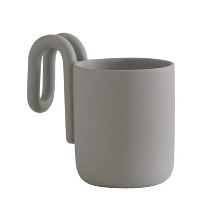 Matte Grey frosted ceramic mug with sculptural loop handle on a white background - RoomDen