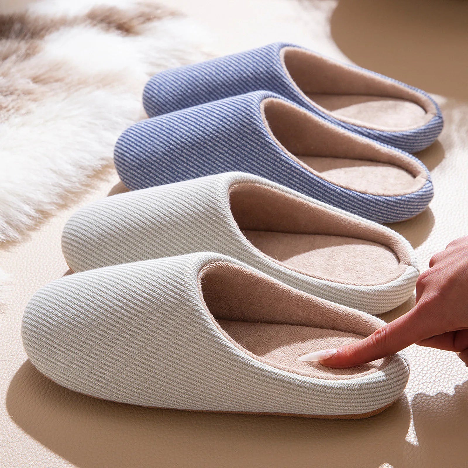 Row of blue grey and beige cotton house slippers texture detail roomden