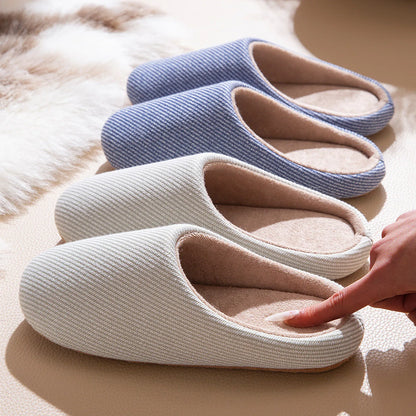 Row of blue grey and beige cotton house slippers texture detail roomden