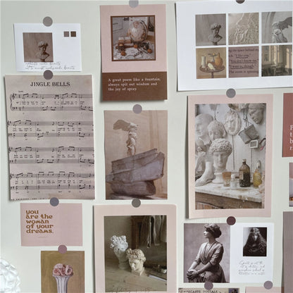 Close-up view of the Vintage Academia wall collage kit, showing details of the sheet music and classical sculpture prints.