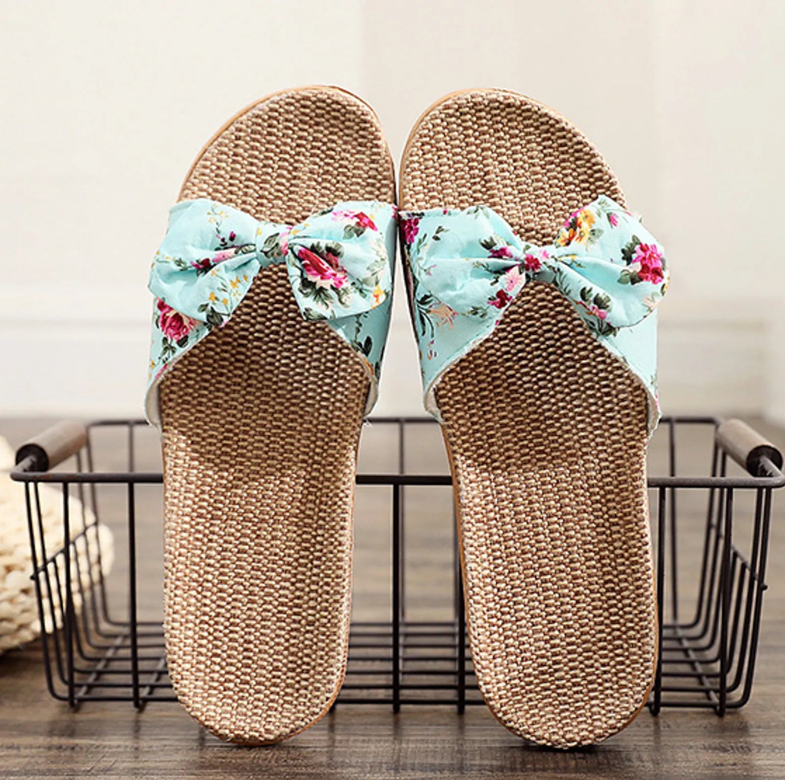 Top view of Aqua Floral Linen Slippers on wire basket - RoomDen