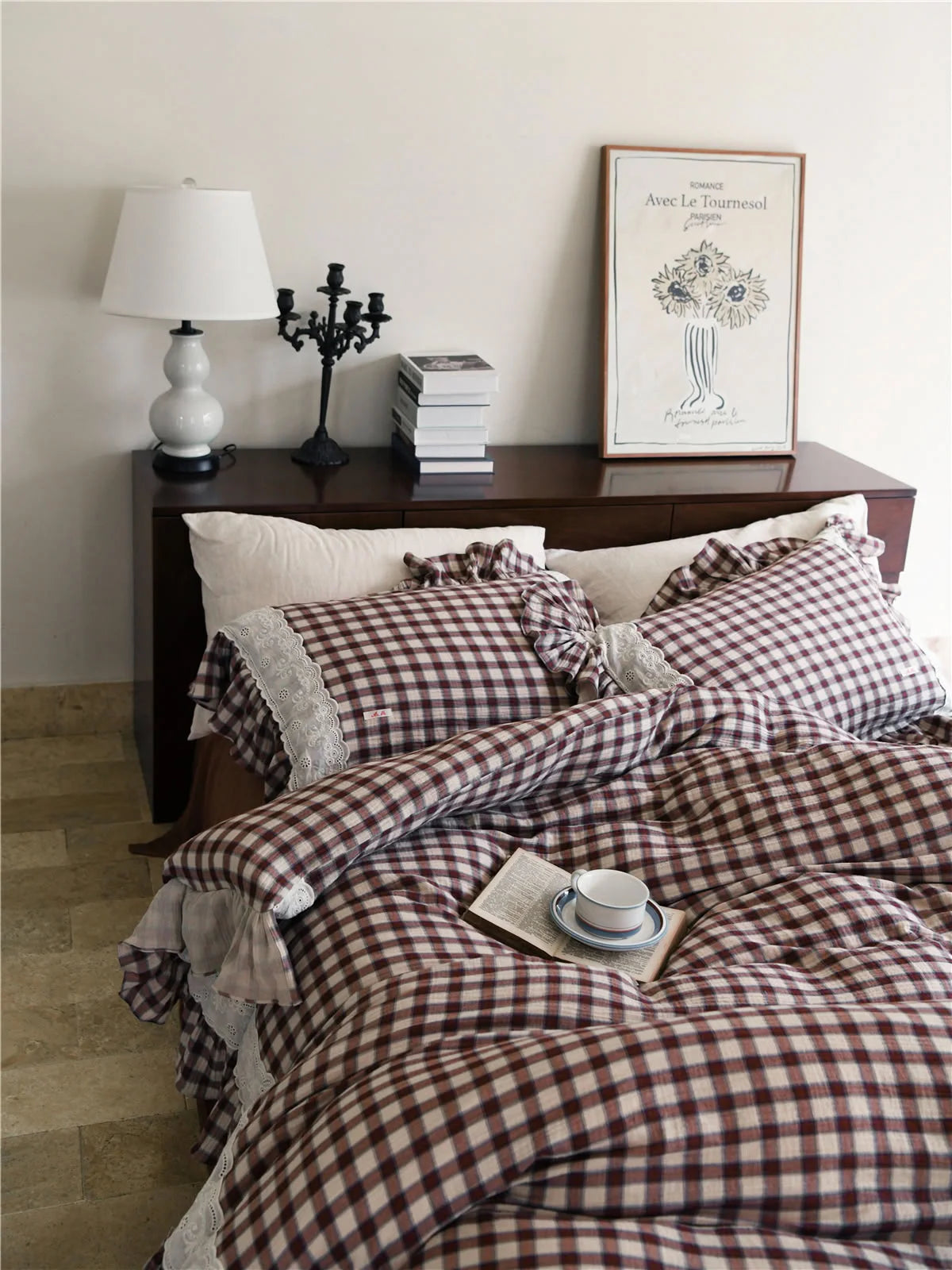 Lifestyle shot of the Brown Gingham Bedding Set with a book and teacup, creating a Light Academia vibe.