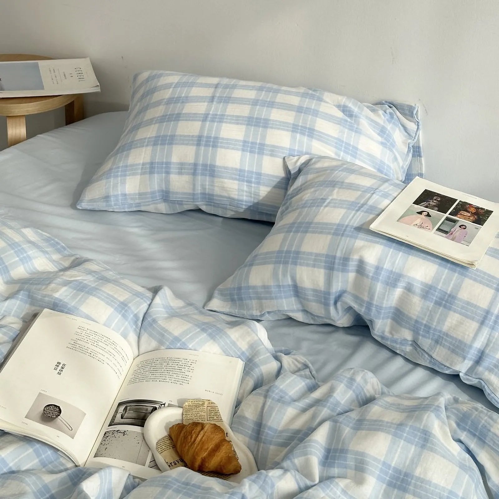 Top-down view of the cozy blue and white gingham bedding set, styled with books for a Light Academia aesthetic. - RoomDen