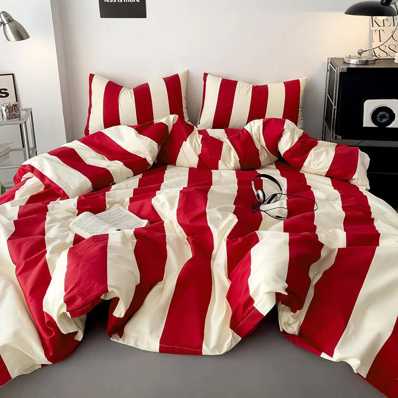 Soft Bold Stripe Cotton Bedding Set in Red & Cream, styled on a bed in a minimalist room - RoomDen