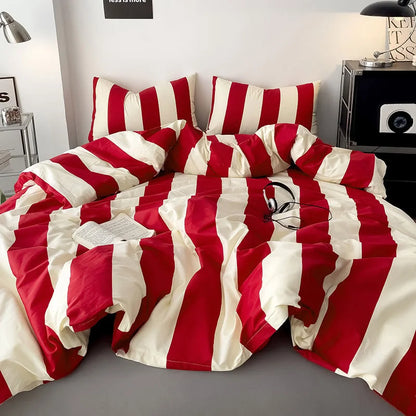 Soft Bold Stripe Cotton Bedding Set in Red & Cream, styled on a bed in a minimalist room - RoomDen